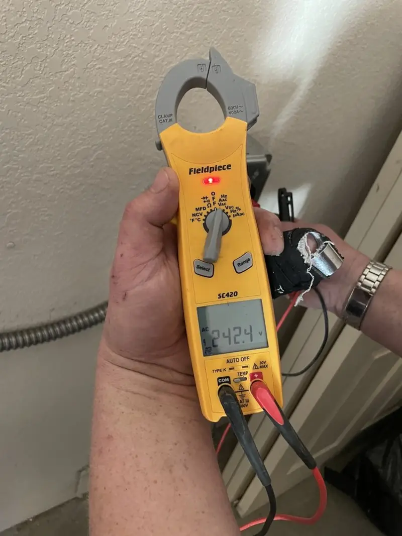 Voltage testing with clamp meter during Electrical Installation Services in Montrose